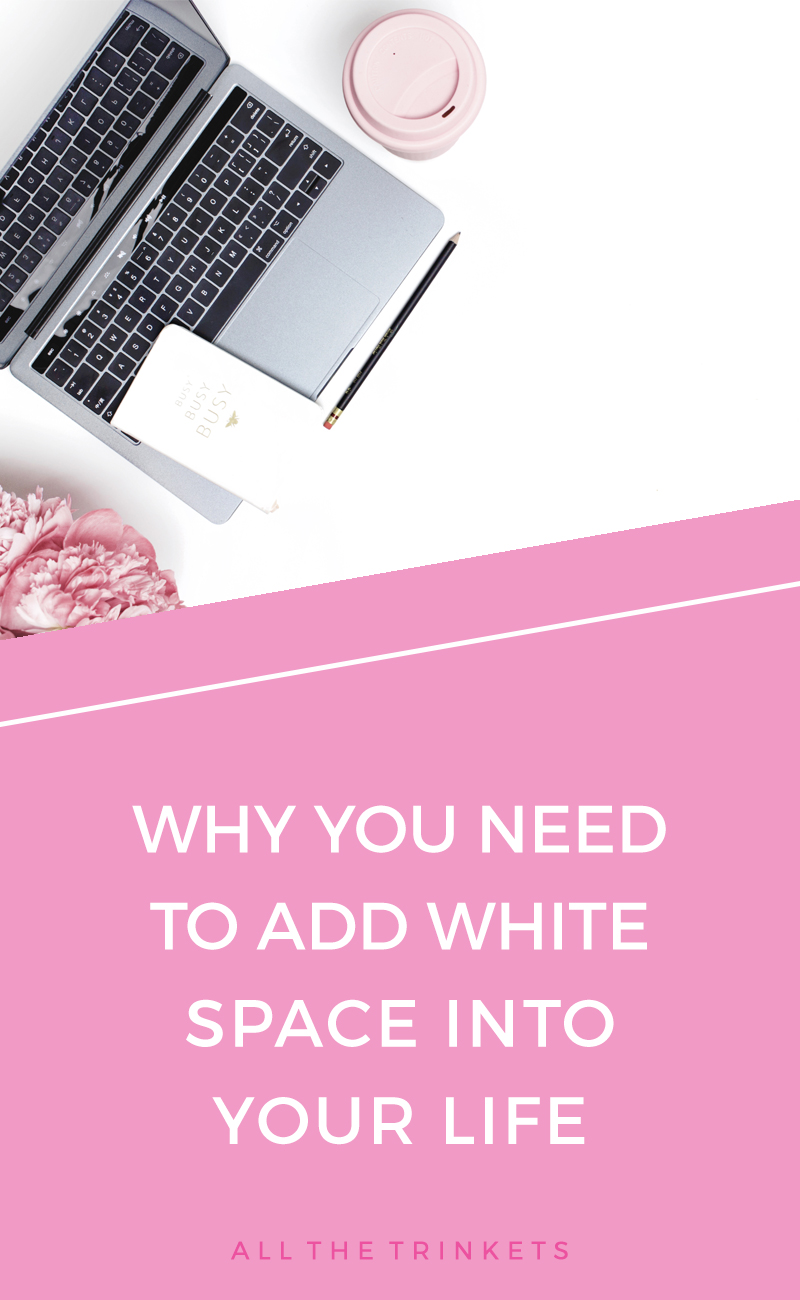 Silver laptop and pink coffee cup on white background. Below is a pink shape overlay with white text - Why You Need to Add White Space into Your Life