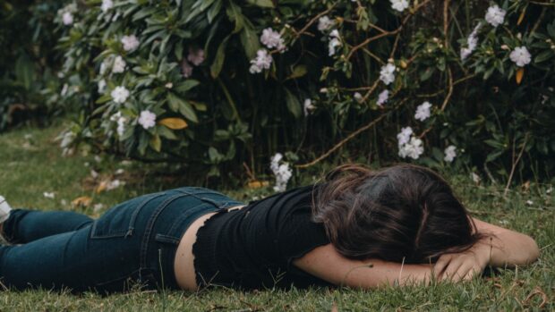 miserable girl among plants